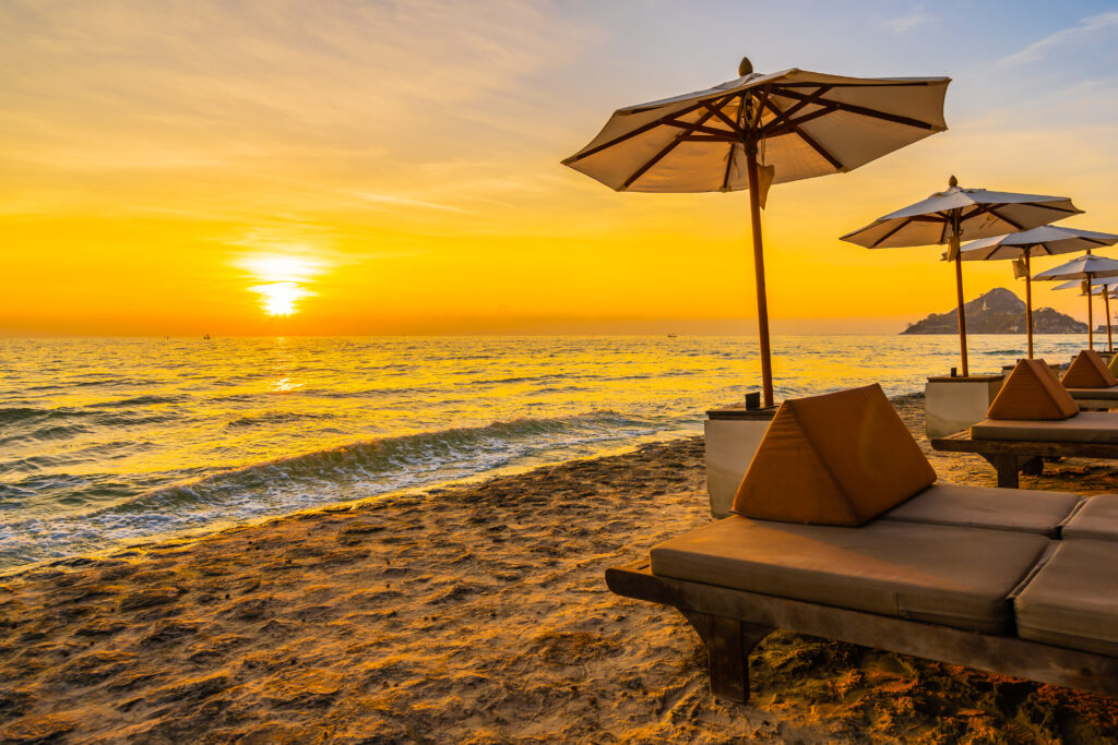 Umbrella and chair with pillow around beautiful landscape of beach in Mombasa, Kilifi, Kenya, Africa